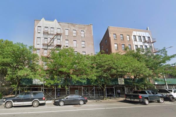 Investigators outside 2157 Southern Boulevard building in East Tremont where a 10-year-old girl allegedly fell to her death